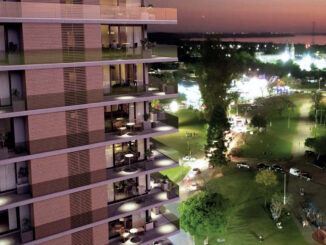 Render del edificio Doit.riviera con vista al río Uruguay en el atardecer